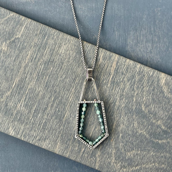 Handmade pendant using faceted blue tourmaline ann oxidized sterling silver